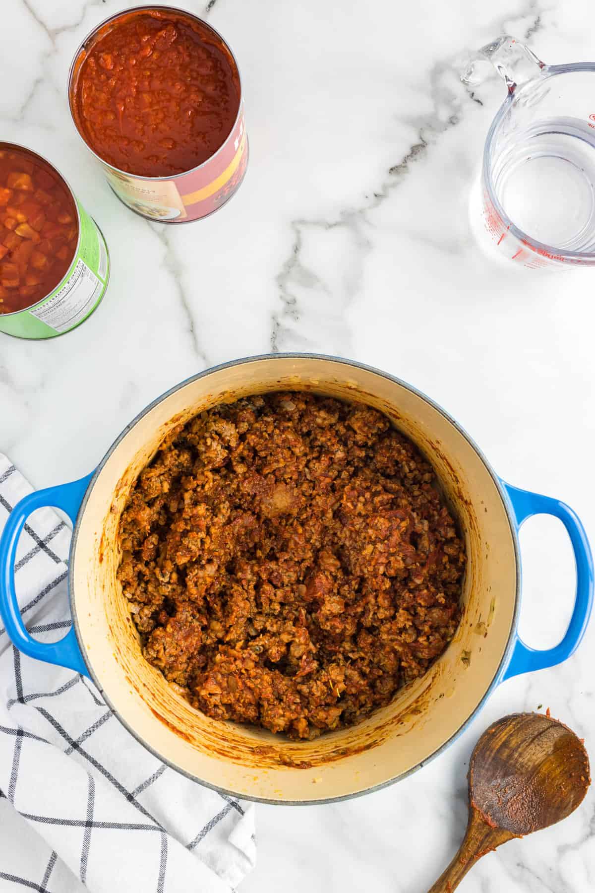 Combined sauce and seasonsed meat in large pot for Homemade Pasta Sauce