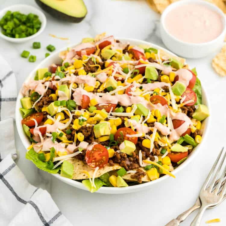 Taco Salad in serving bowl with added fixings