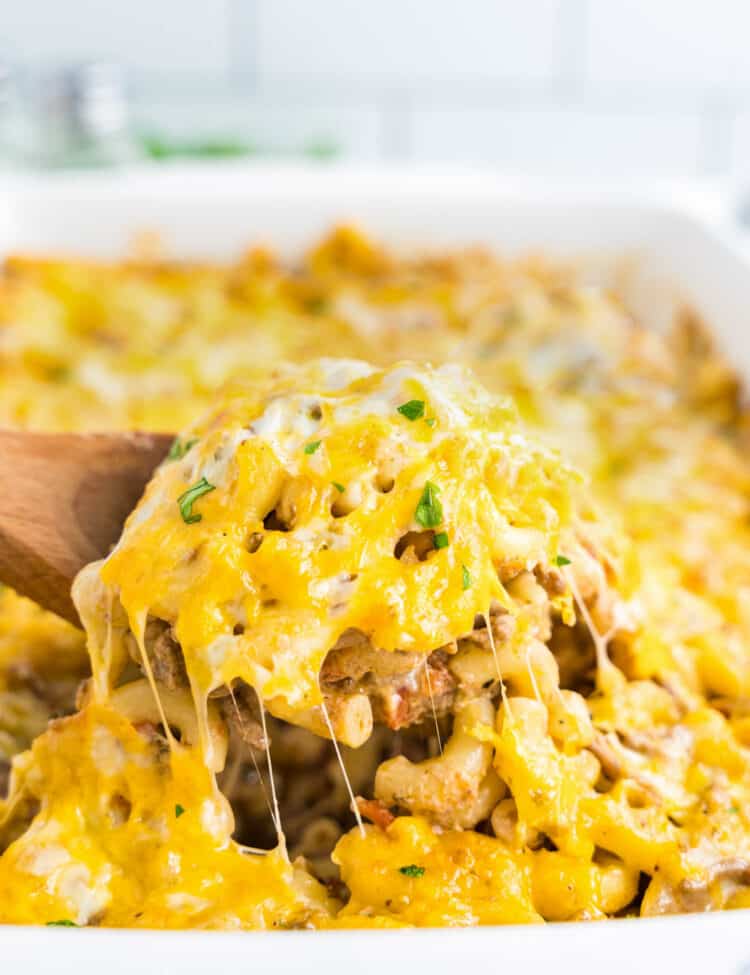 Cheeseburger Casserole Recipe in Baking Dish with Wooden Spoon Scooping