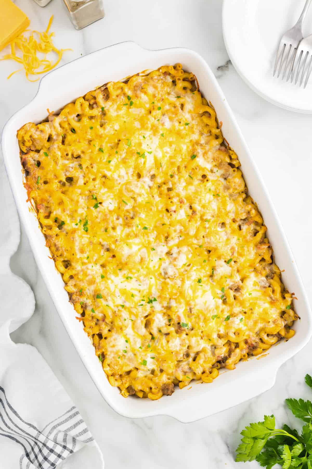 Cheeseburger Casserole Topped with Melted Cheese in Baking Dish Right Out of the Oven