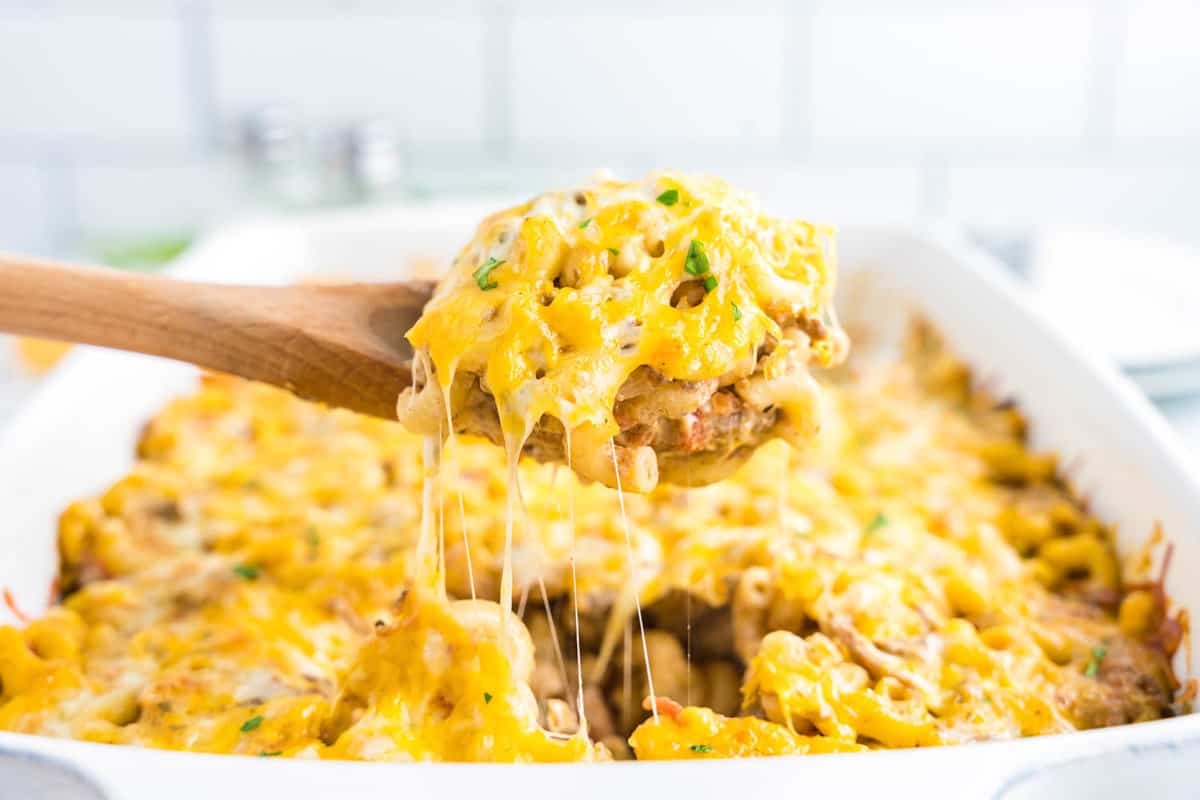 Cheeseburger Casserole Recipe in Baking Dish with Wooden Spoon Scooping