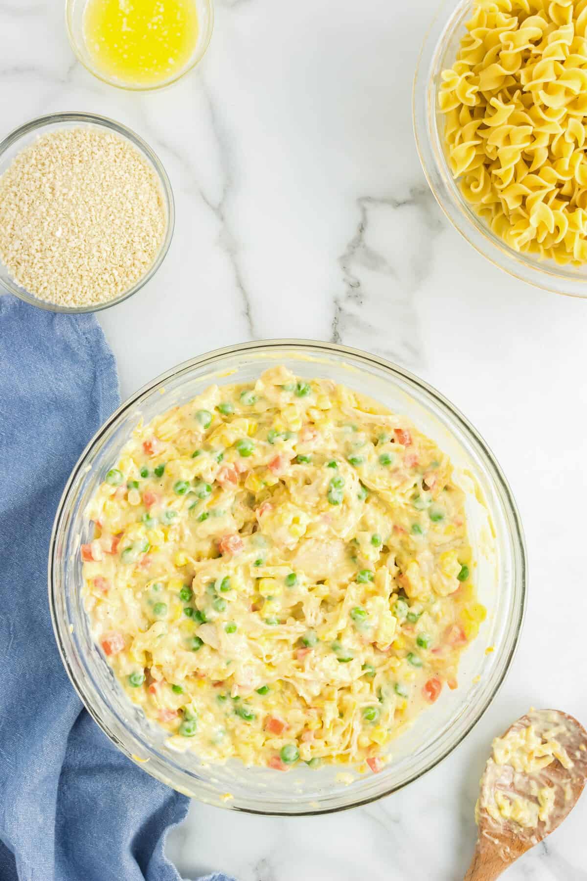 Blending ingredients for Chicken Noodle Casserole in mixing bowl