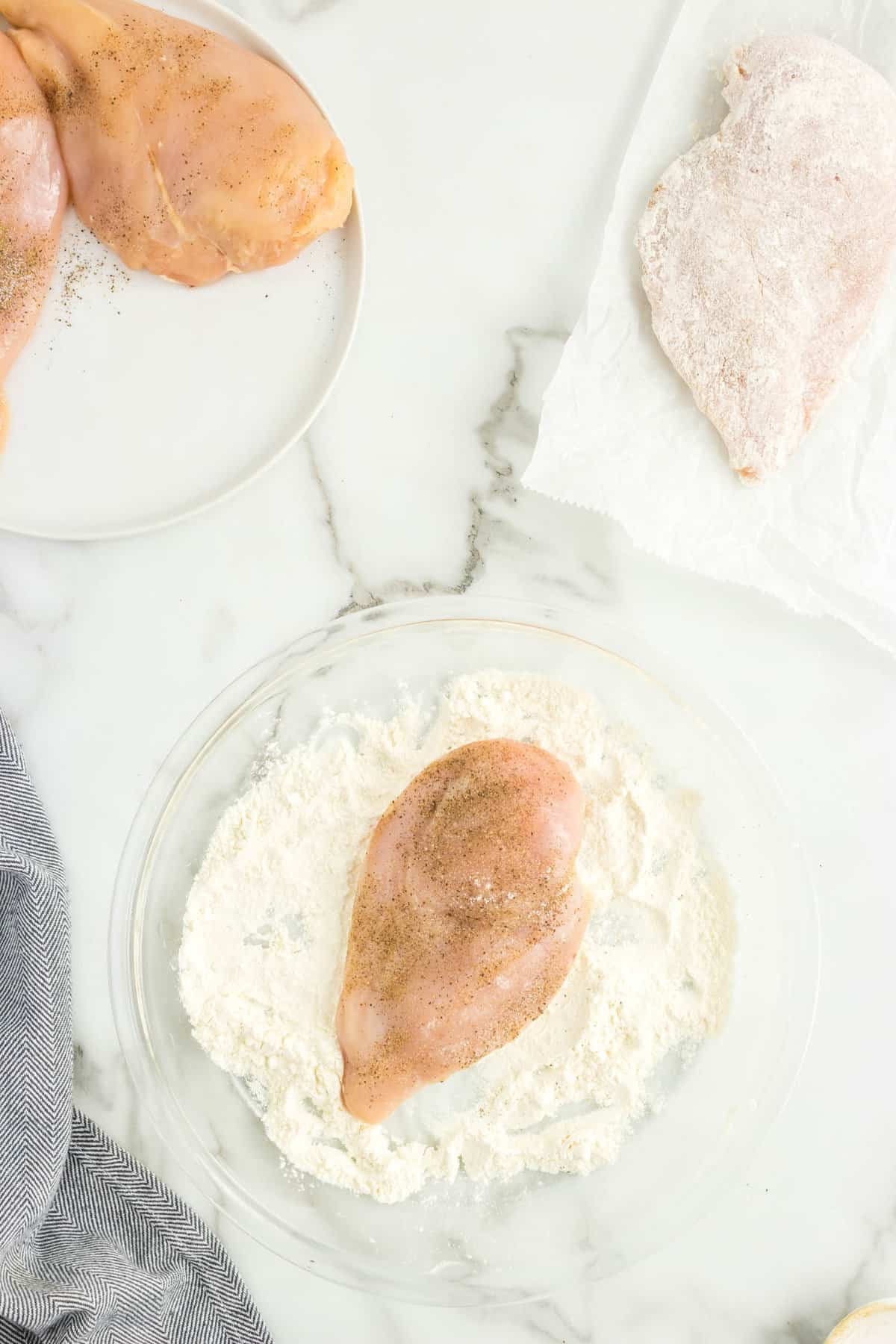 Boneless, skinless chicken breast in flour and seasoning for Marry Me Chicken Recipe