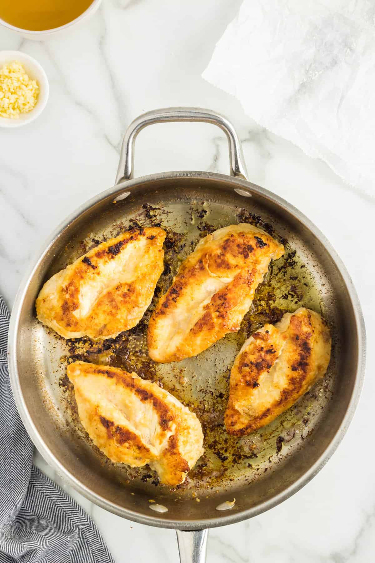 Cooking chicken breasts in pan for Marry Me Chicken Recipe