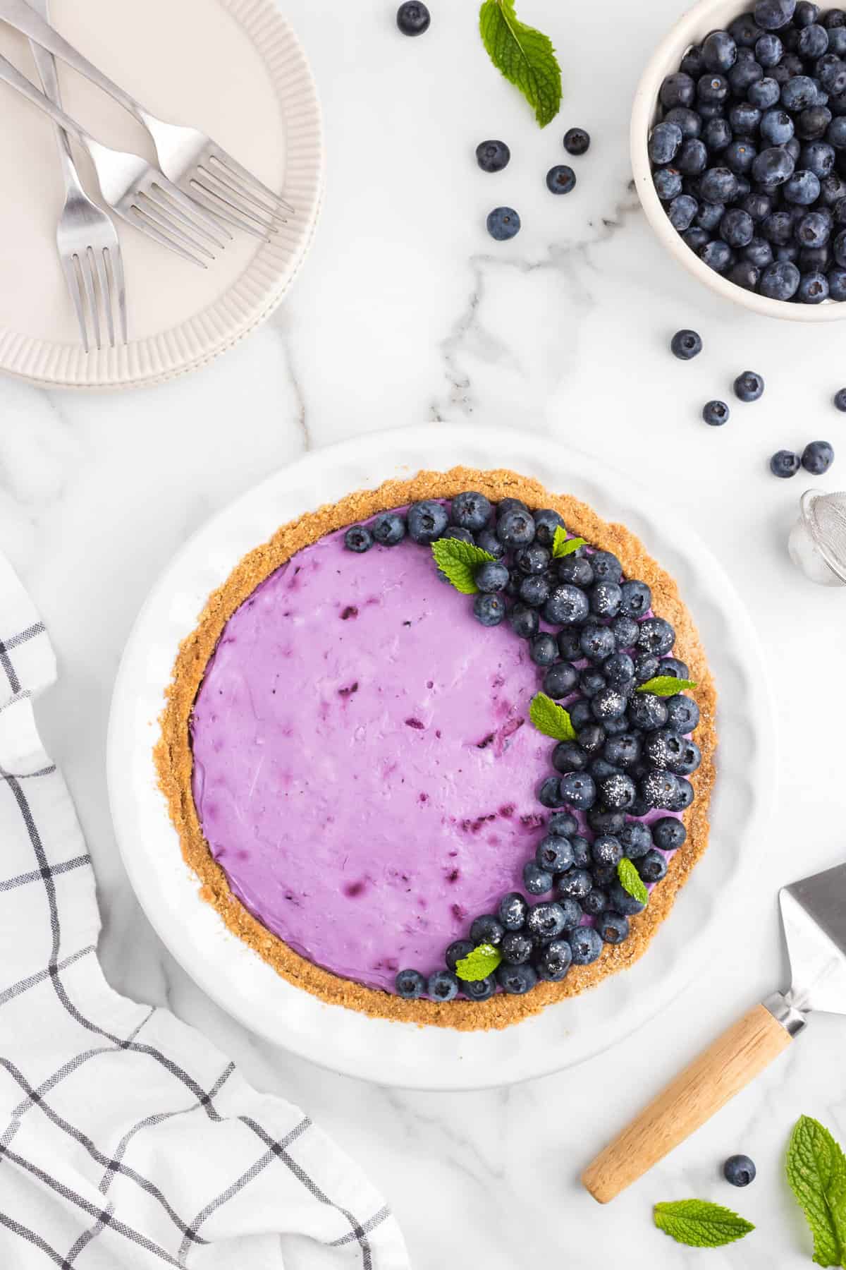 Topping with sugared blueberries and mint