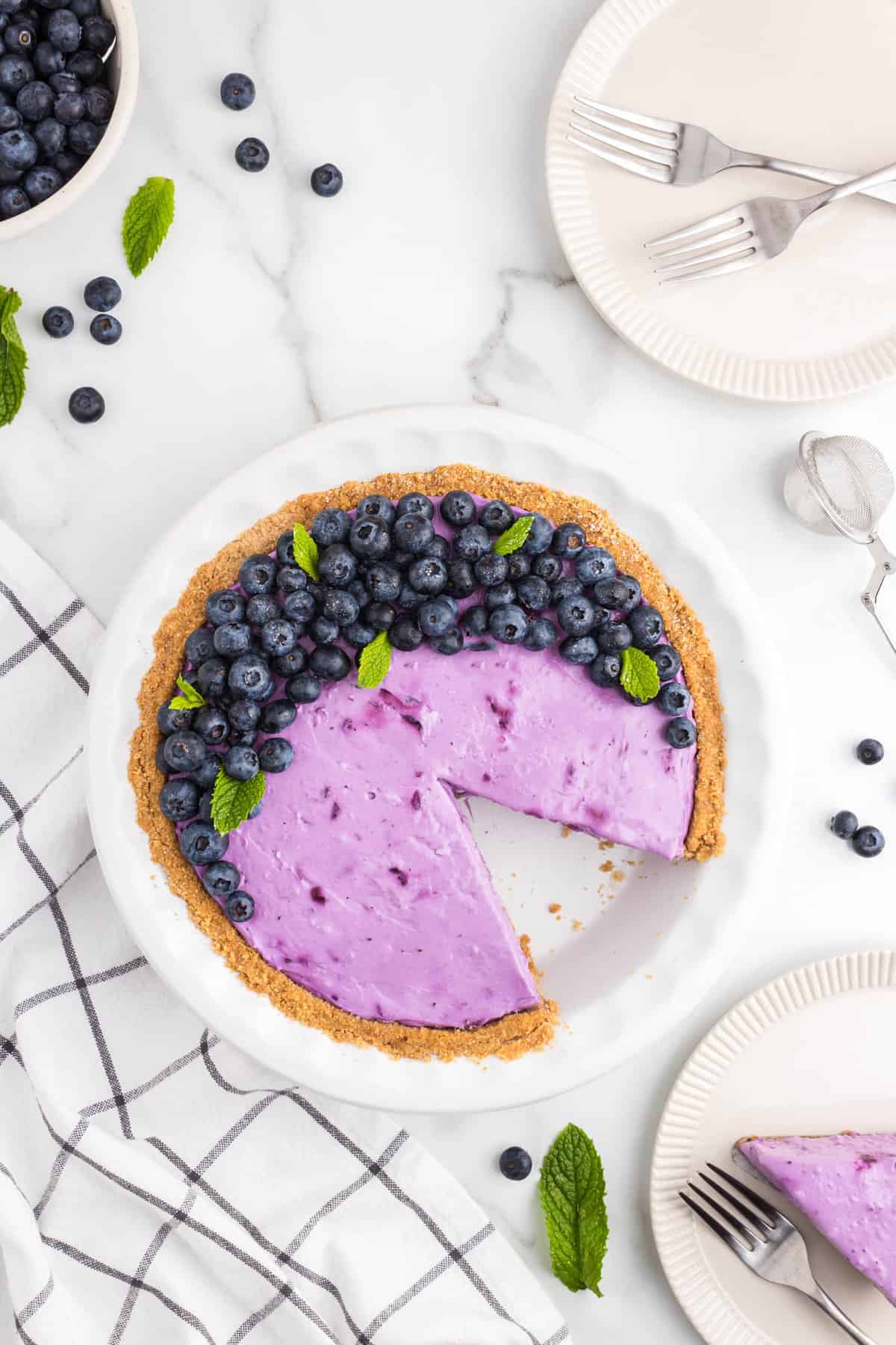 No Bake Blueberry Cheesecake with one cut slice