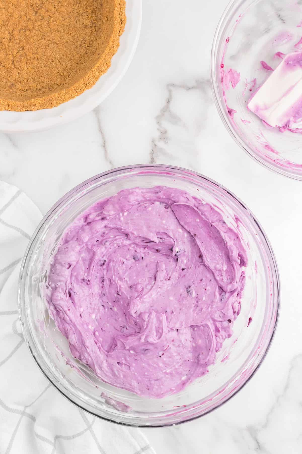 Blueberry cream cheese filling in bowl for No Bake Blueberry Cheesecake recipe