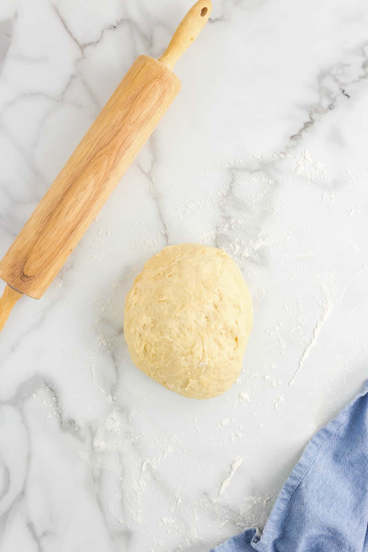 Rolling dough into ball for Oreo Cinnamon Rolls