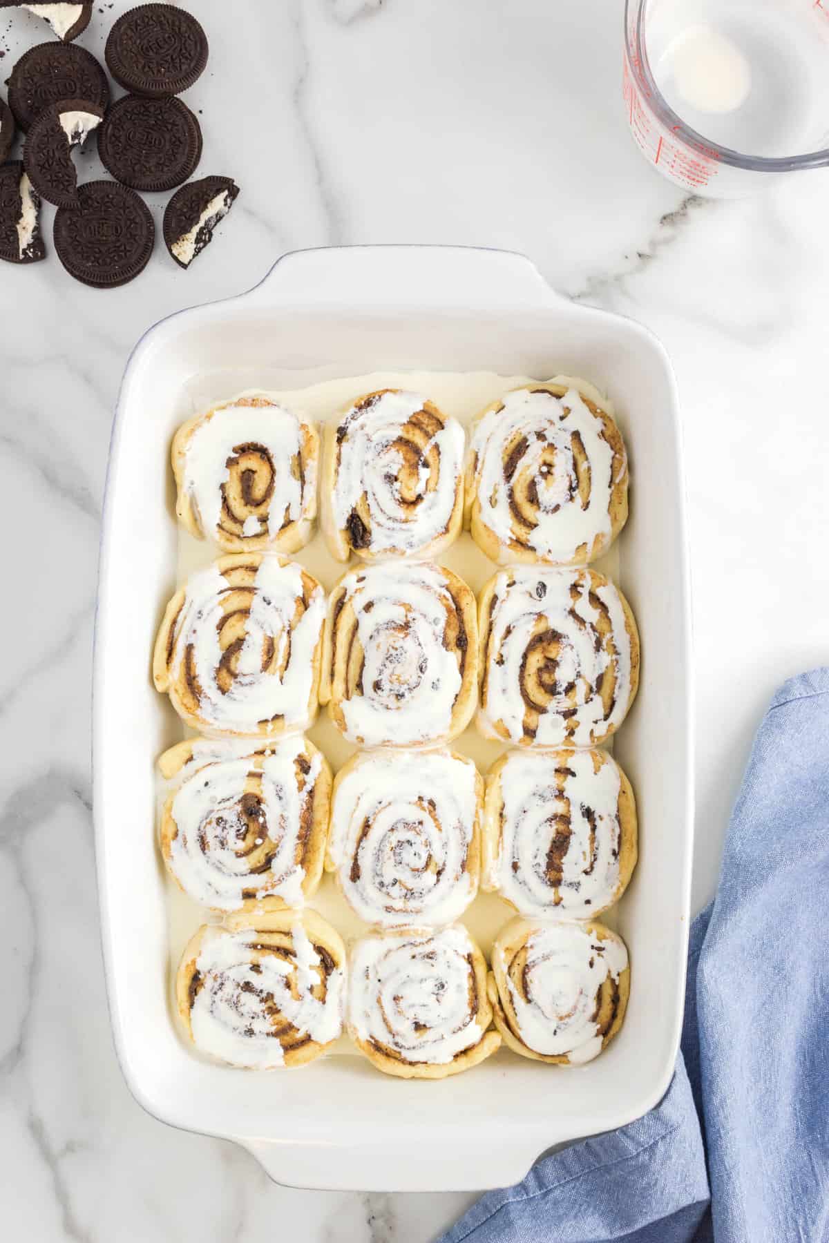 Lighting coating rolls in pan for Oreo Cinnamon Rolls recipe