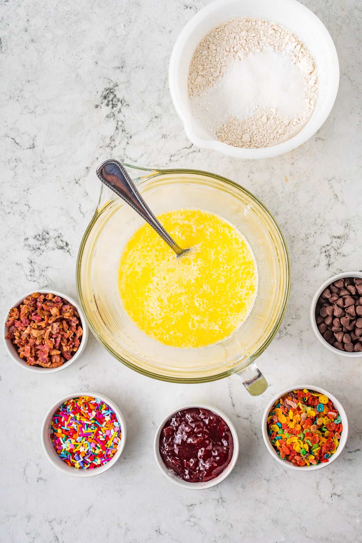 Add the Buttermilk, Eggs, Butter and Vanilla together in a small bowl and beat