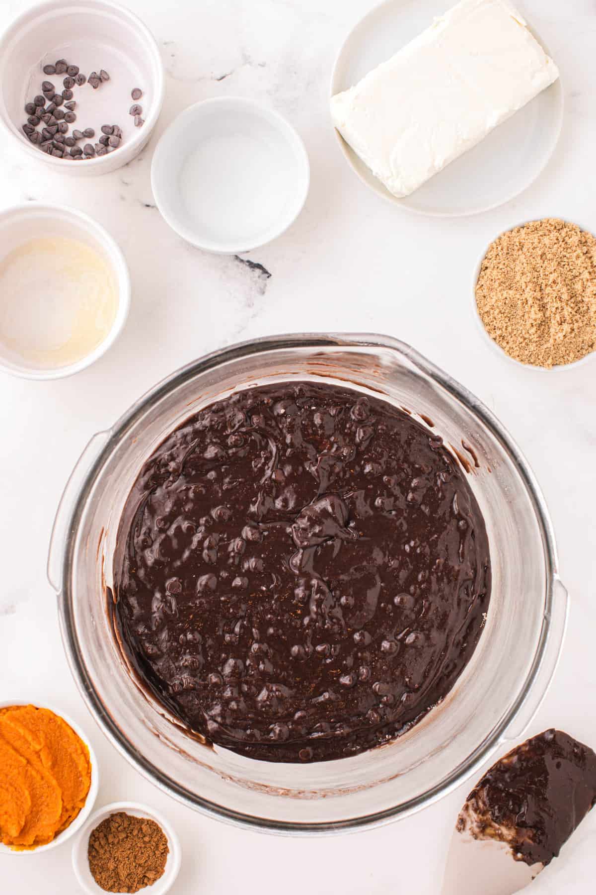 Combined brownie ingredients for Pumpkin Brownies in bowl