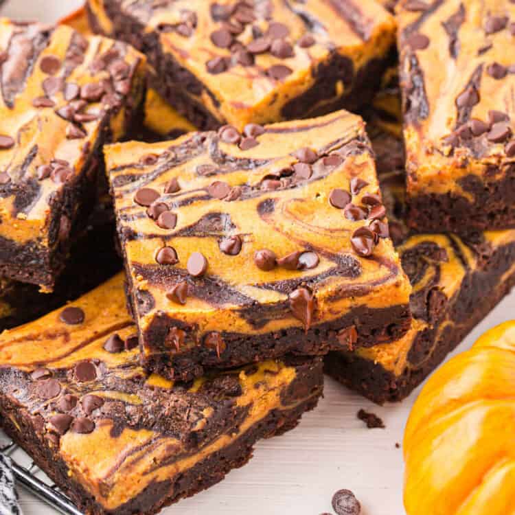 Pumpkin Brownies cut into squares on plate