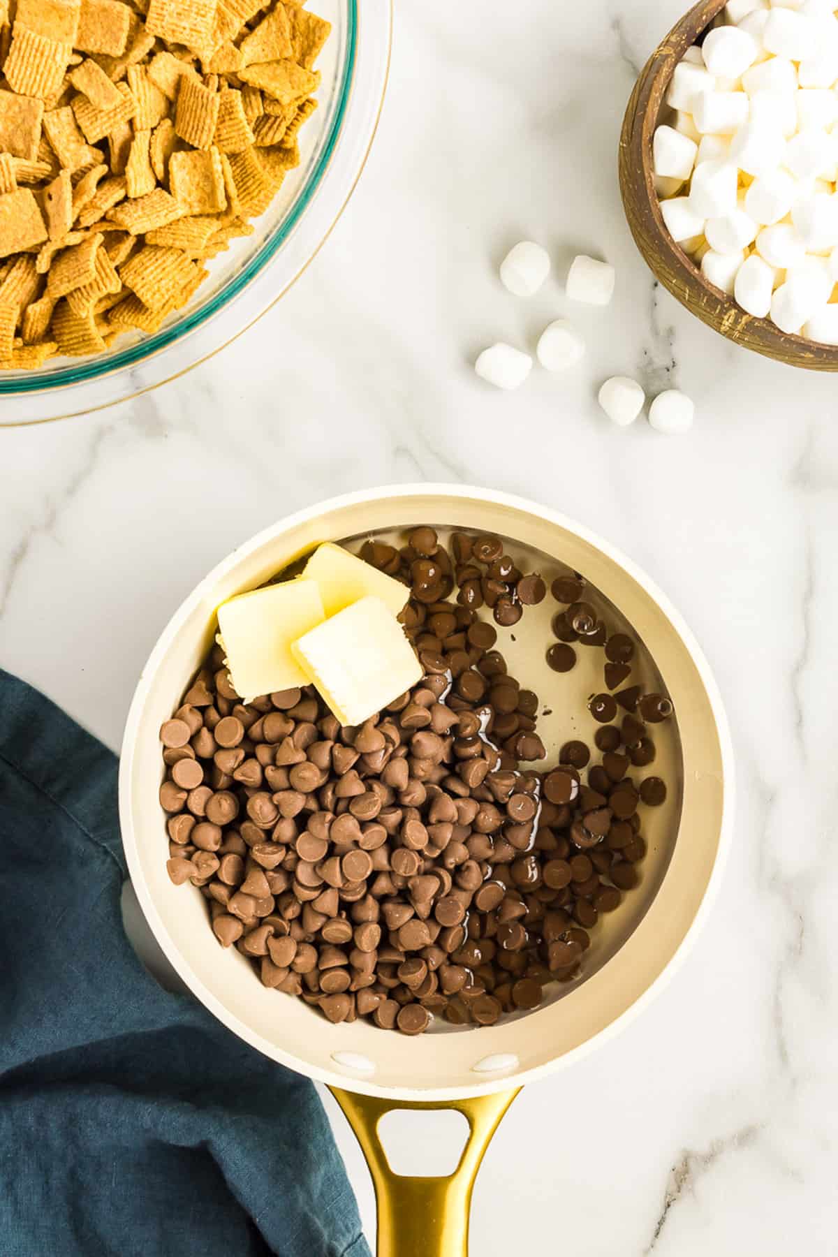 slowly Melt the chocolate chips, corn syrup and butter in a pan.