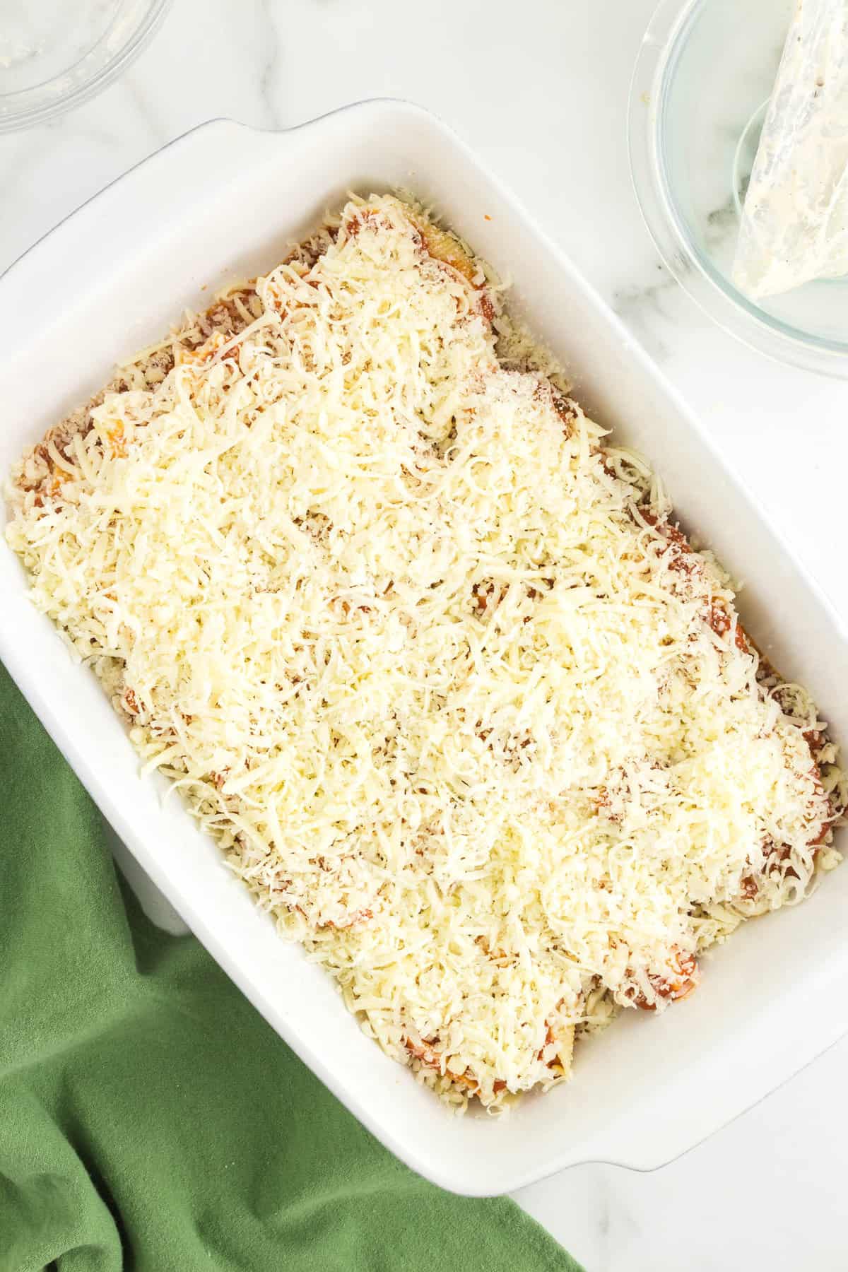 Shredded Cheese Covering Pasta for Stuffed Shells Recipe