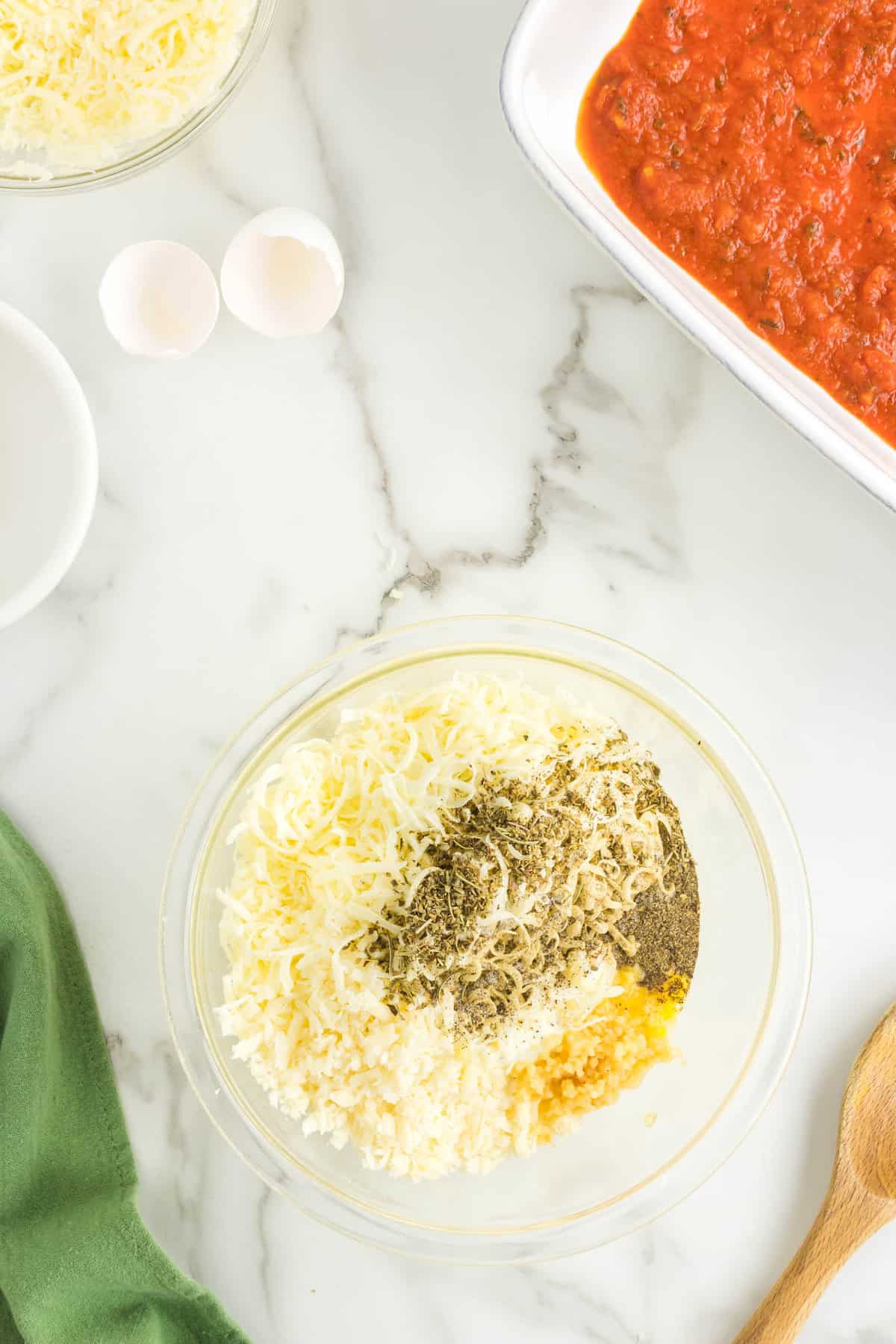 Combining the Cheesey Mixture in Mixing Bowl for Stuffed Shells