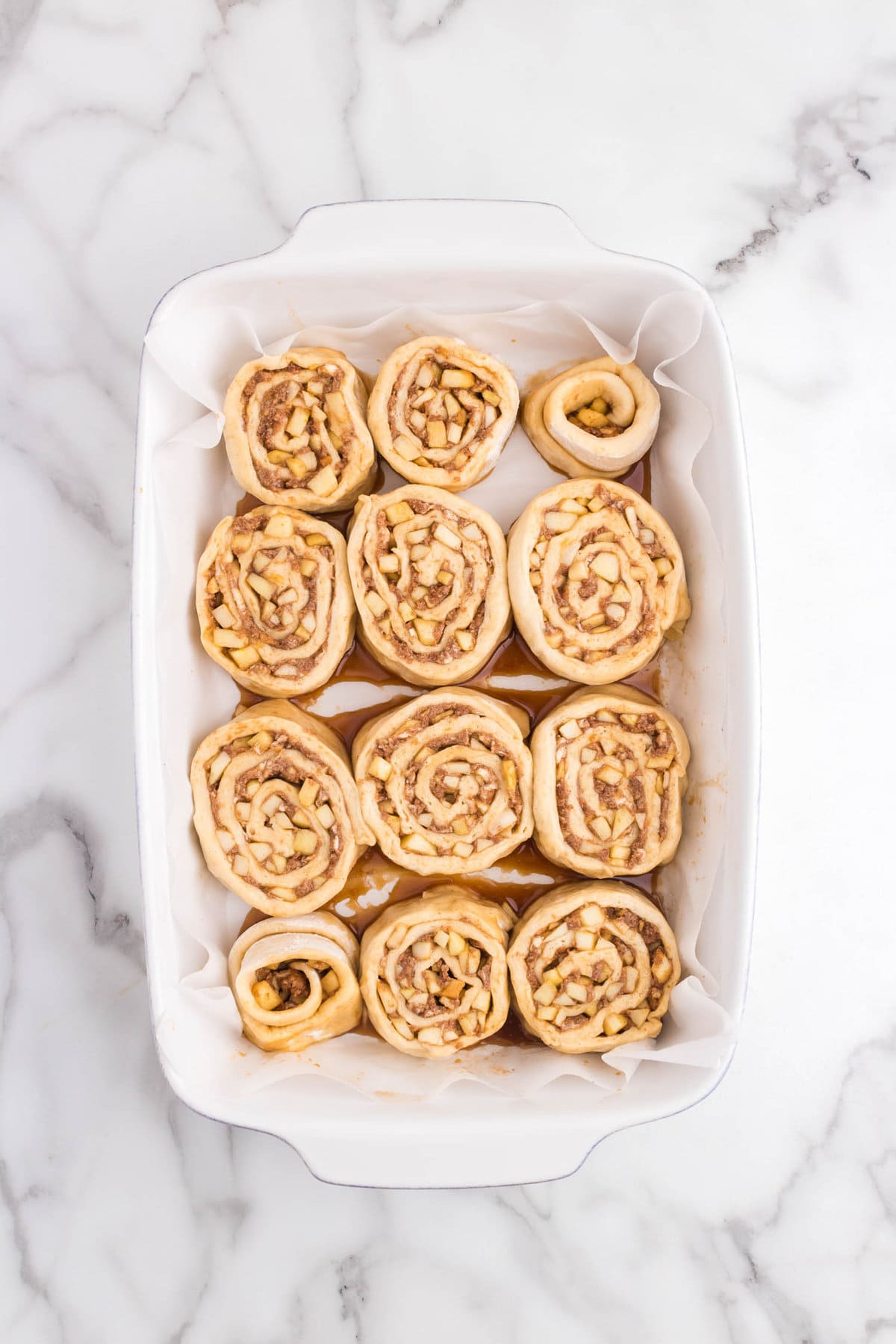 Unbaked Apple Cinnamon Rolls in baking dish