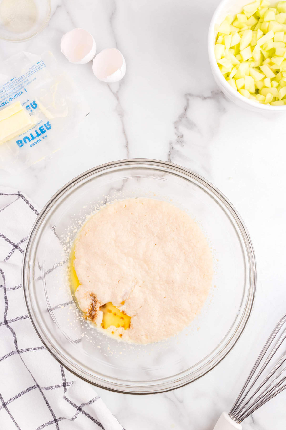 Combining ingredients for Apple Cinnamon Rolls dough in mixing bowl