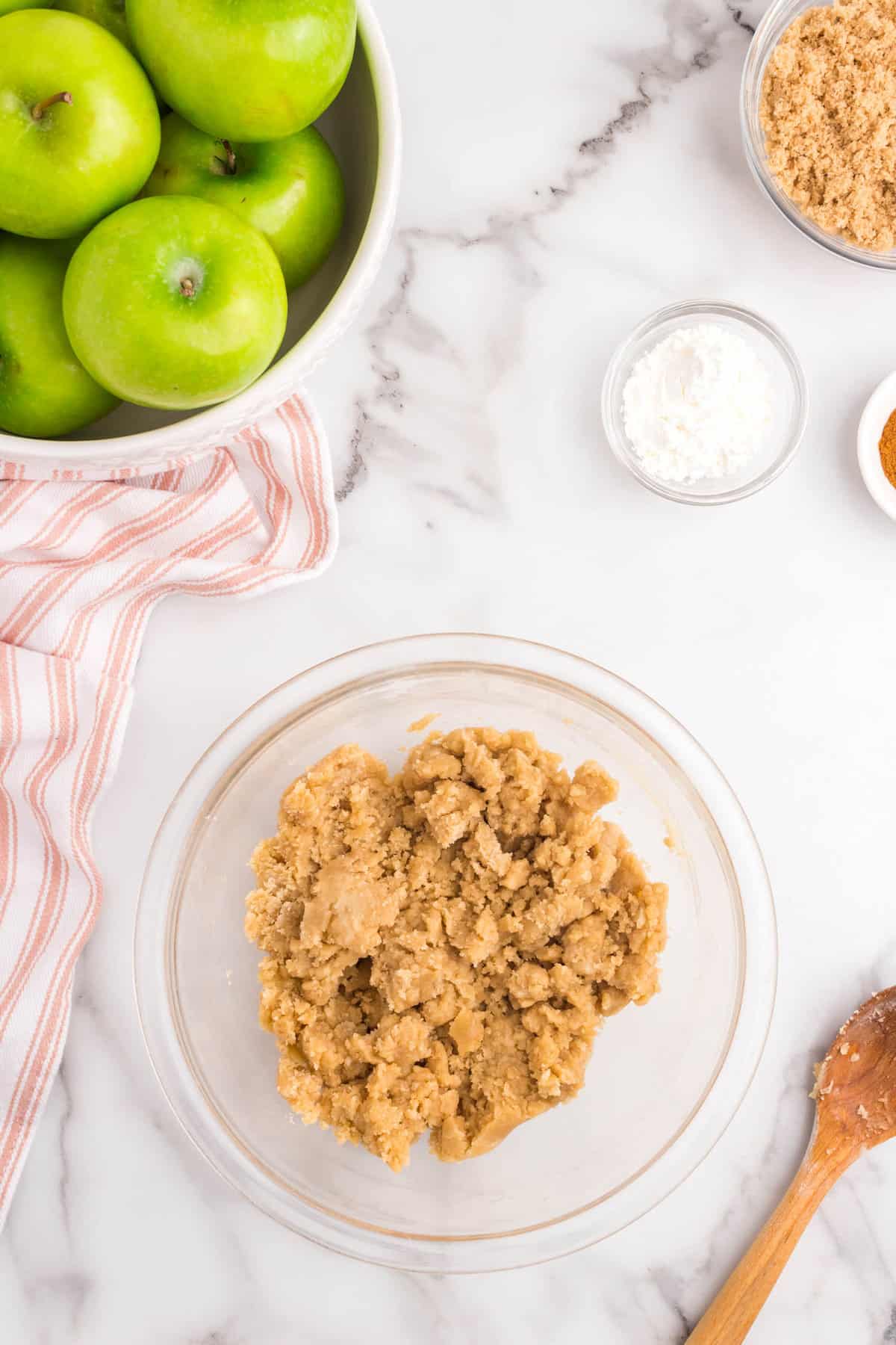 Apple Crumble topping ingredients mixing together in bowl