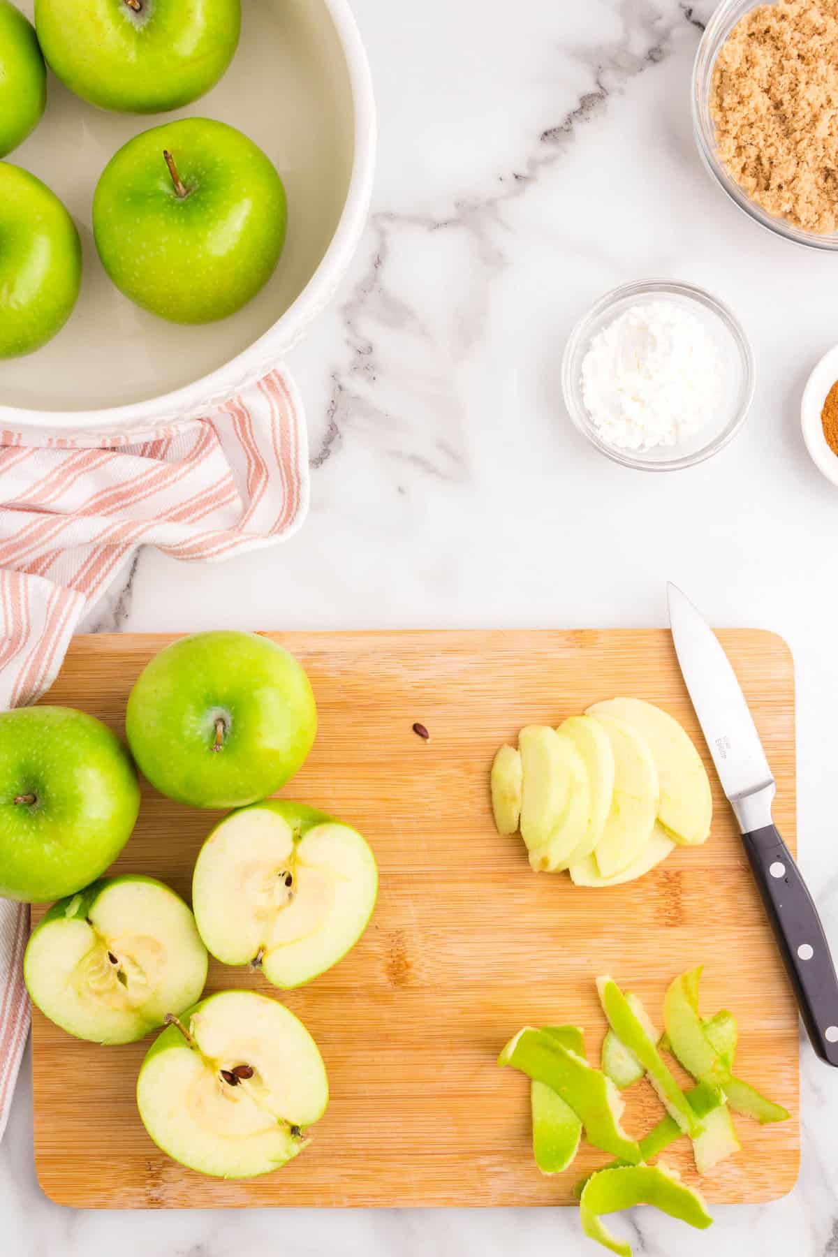 Preparing granny smith apples on cutting board for Apple Crumble recipe
