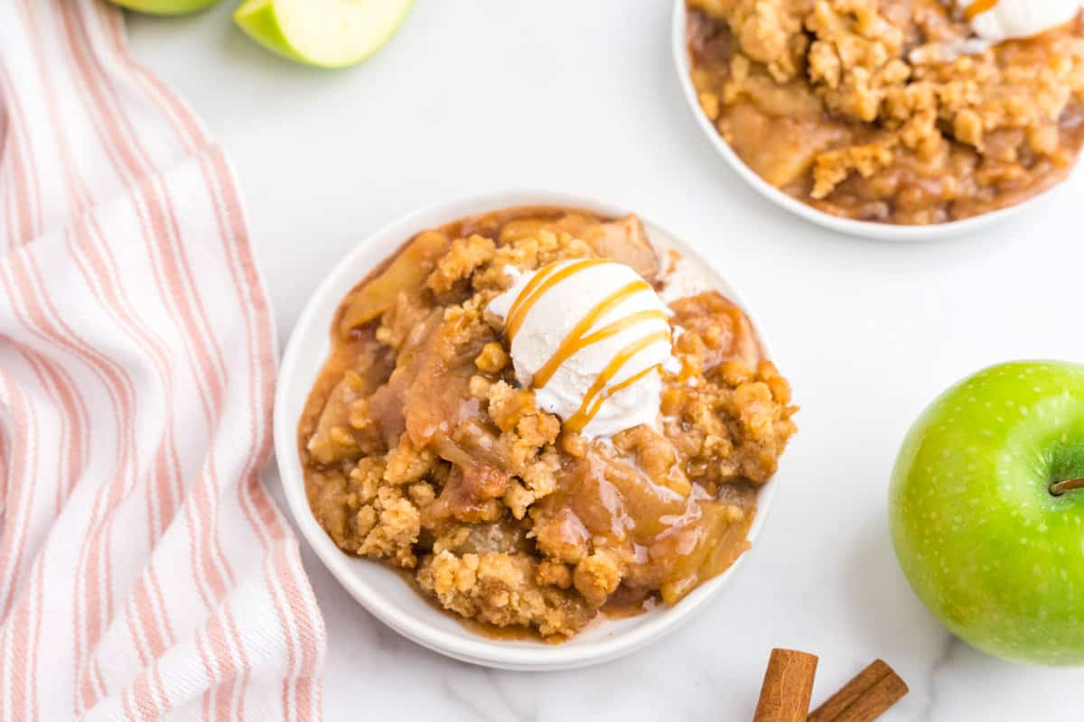 Apple Crumble Recipe on plate with ice cream and caramel