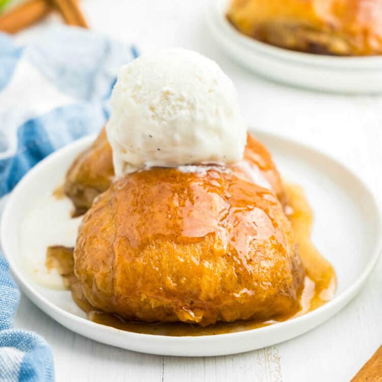 Apple Dumplings on plate topped with ice cream