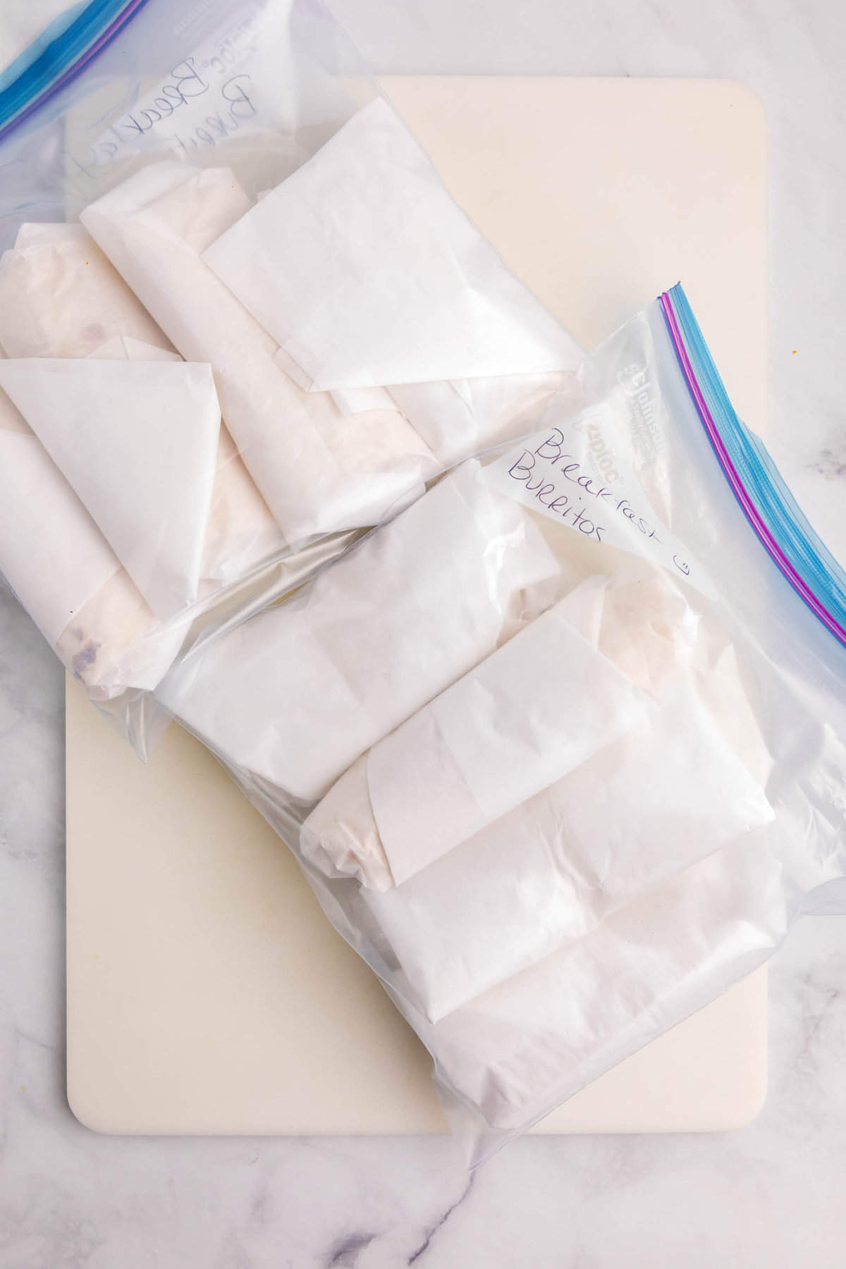 Reusable plastic bag with freezer breakfast burritos