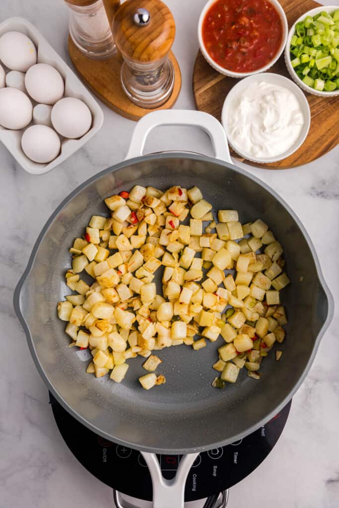 Skillet with cooked potatoes o'brien