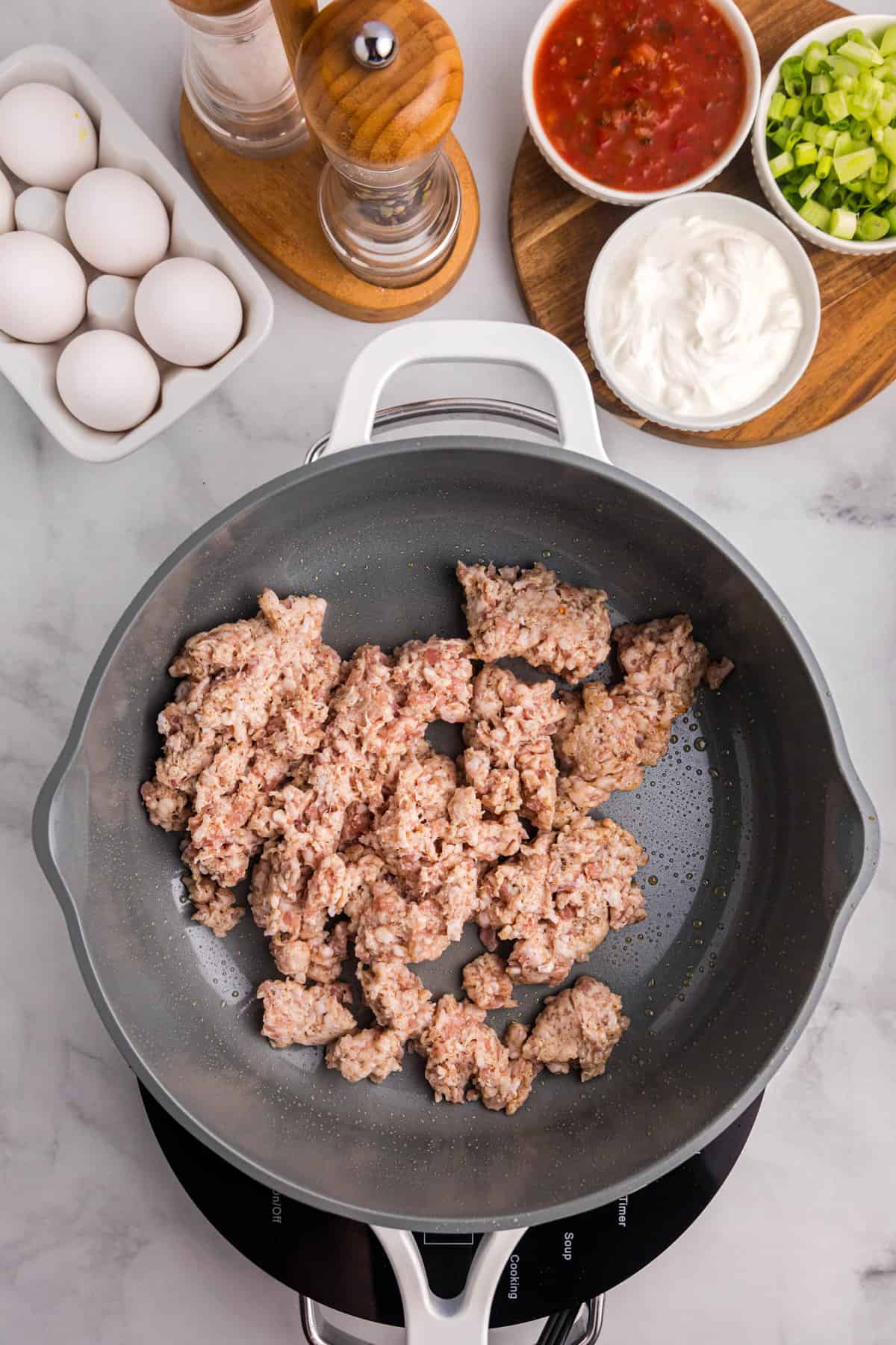 Skillet with raw ground sausage