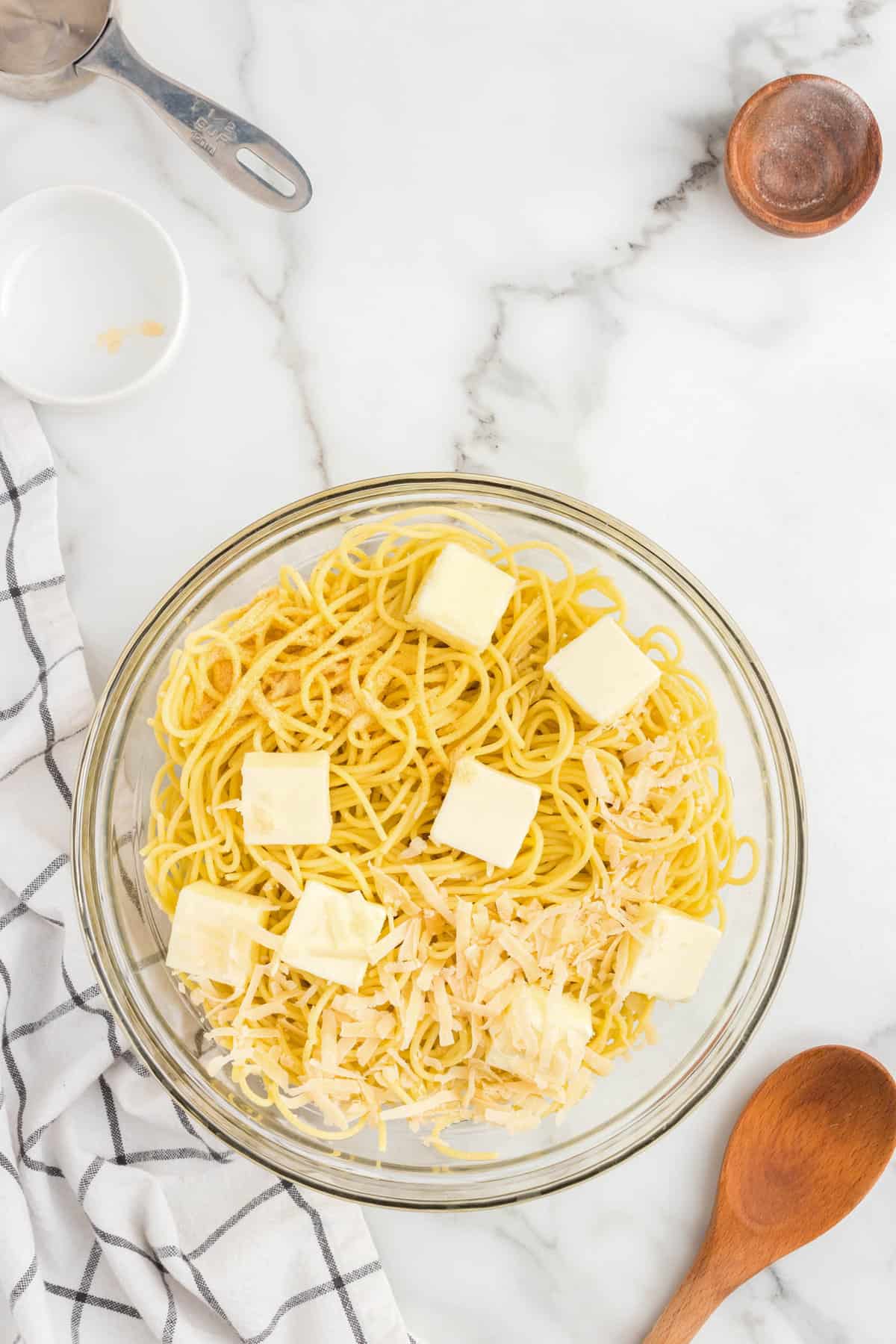 Add the Garlic Powder and Parmesan Cheese to the Noodles.