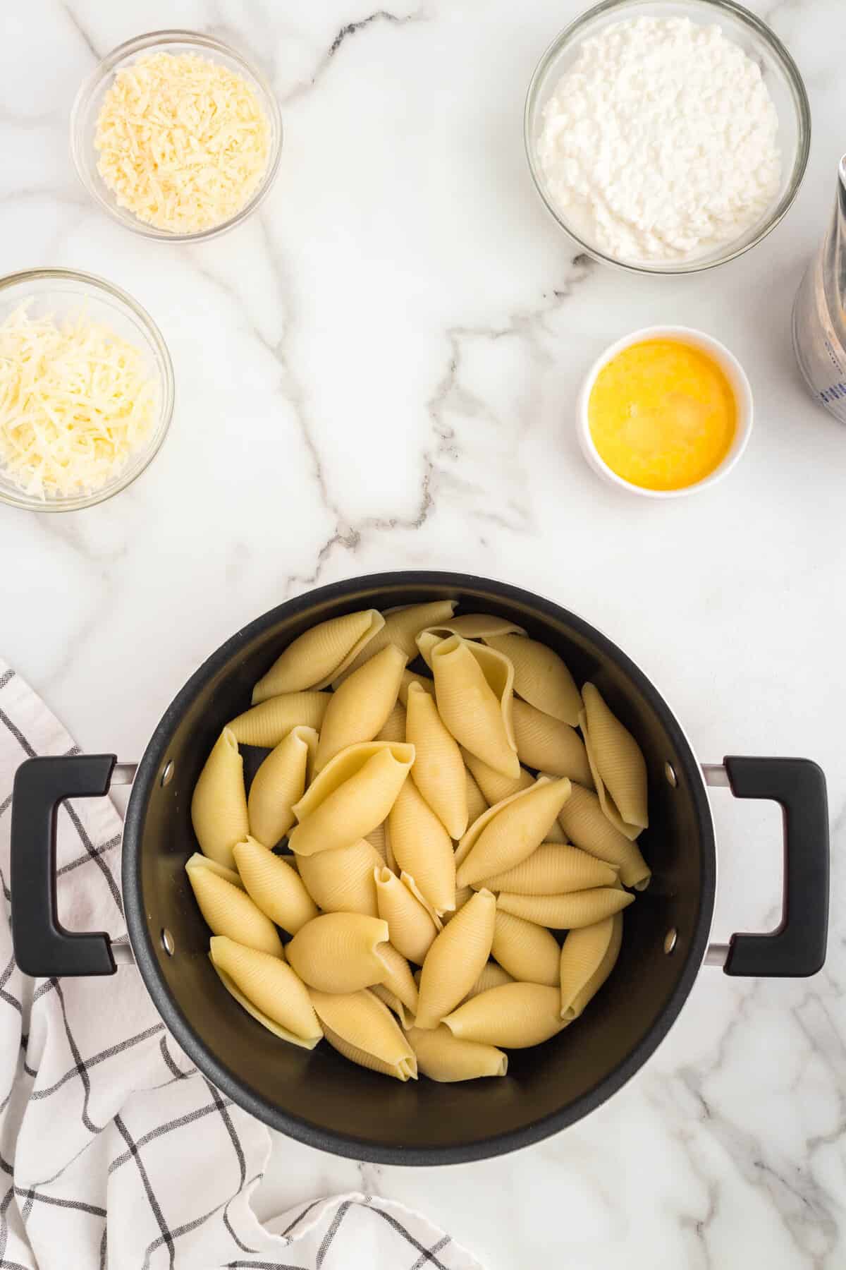 Jumbo past shells in stovepot pan for Chicken Alfredo Stuffed Shells recipe