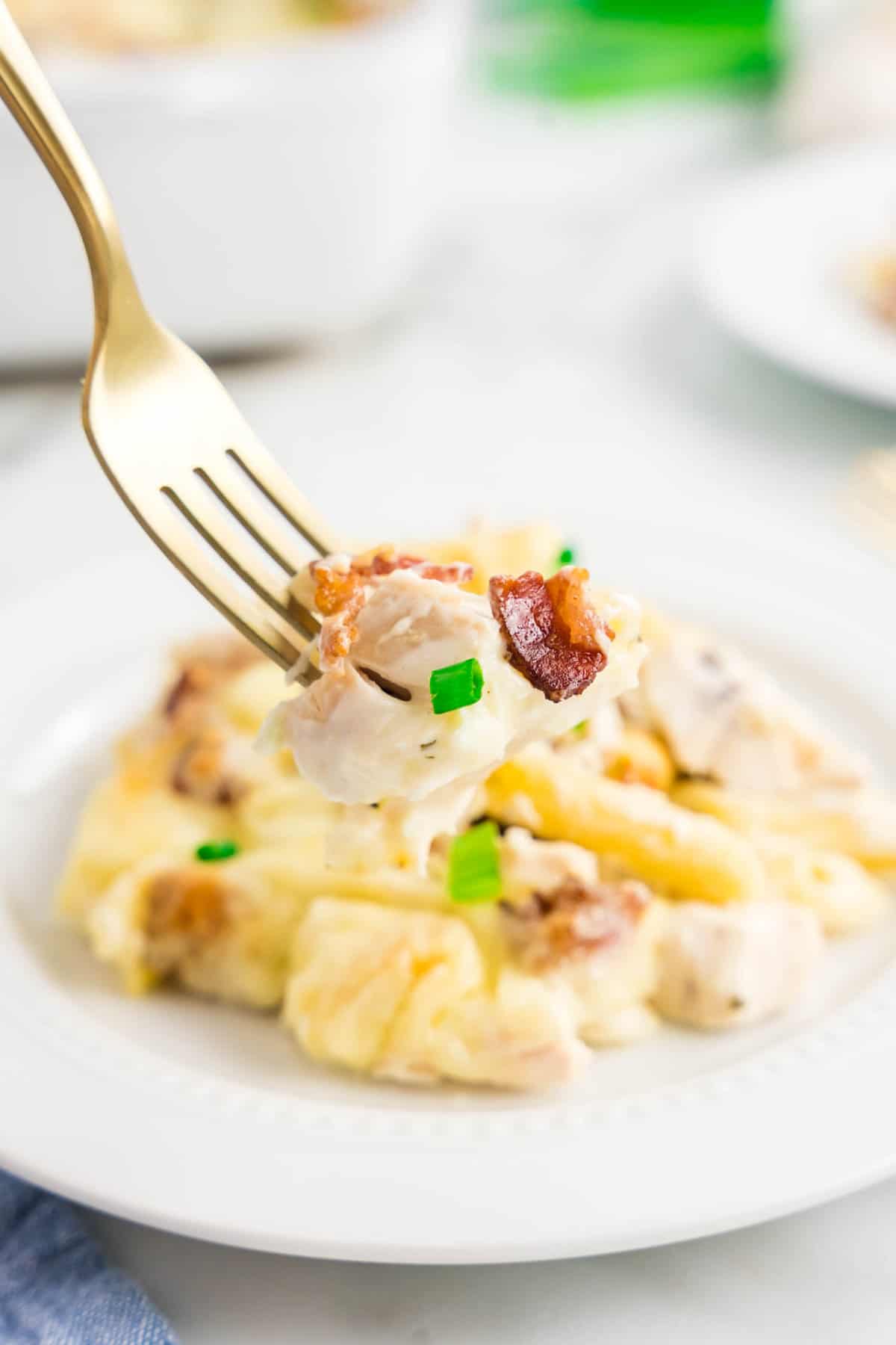 Ready for the first bite of Chicken Bacon Ranch Casserole on plate with fork