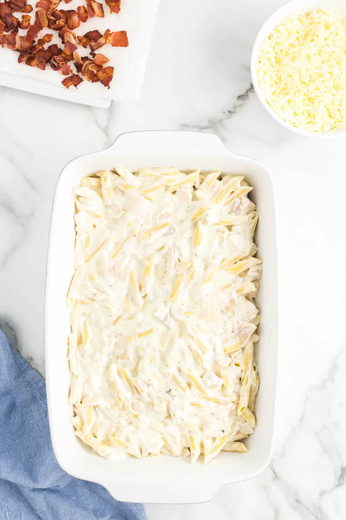 Spreading mixture in 9x13 baking dish for Chicken and Bacon Casserole