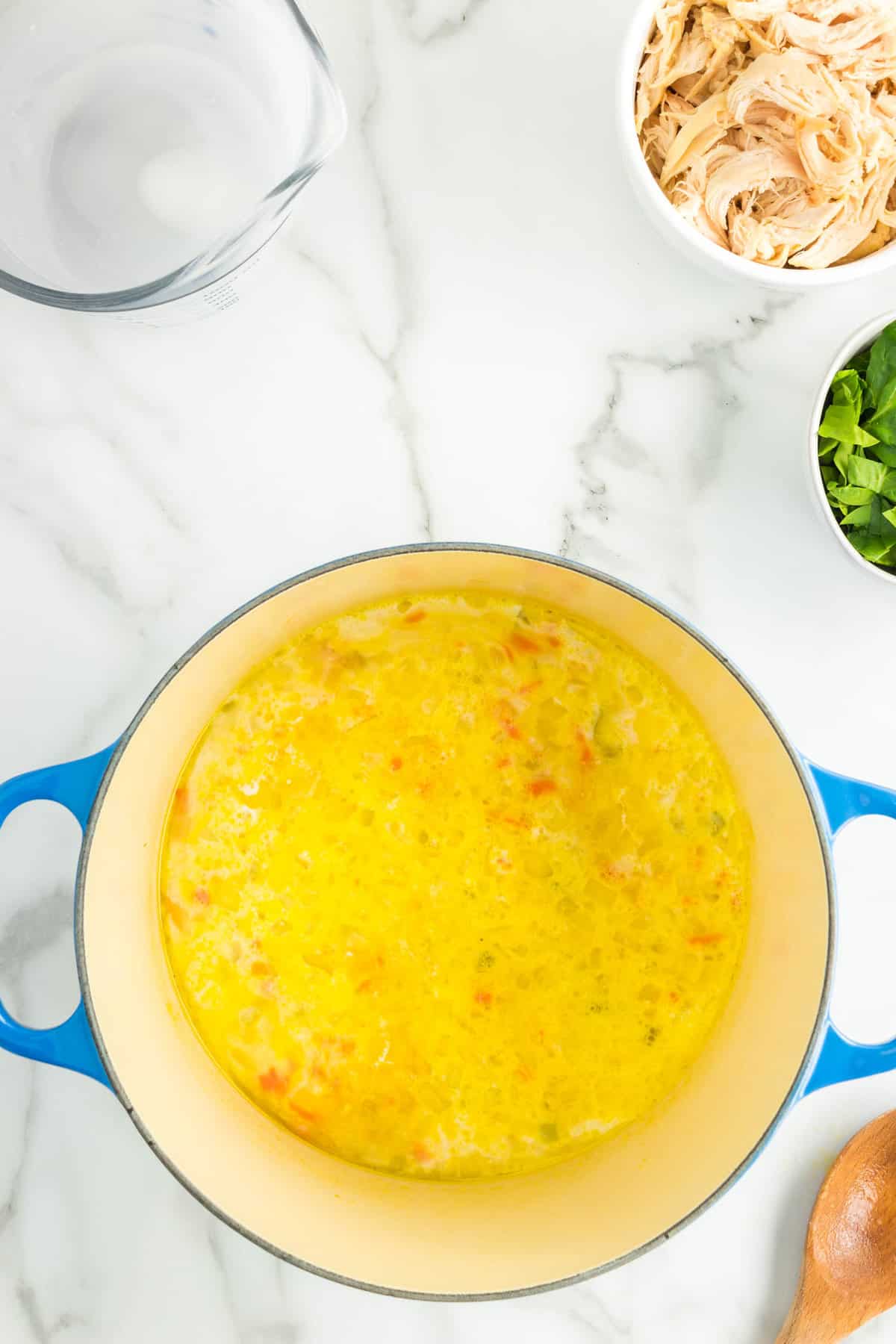 Adding Ingredients to Vegetables for Chicken and Gnocchi Soup Recipe