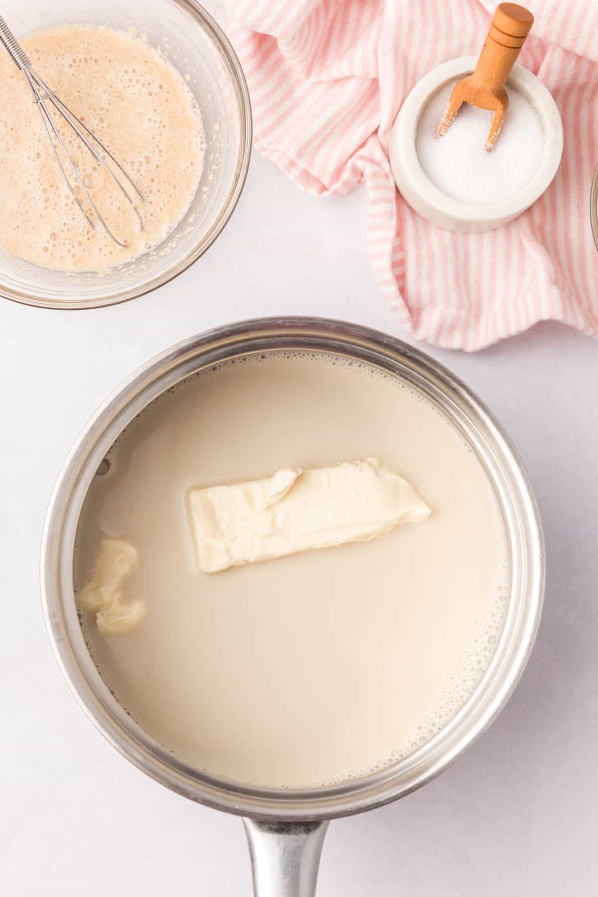 Butter, sugar, and milk in a saucepan for Cinnamon Swirl Bread recipe