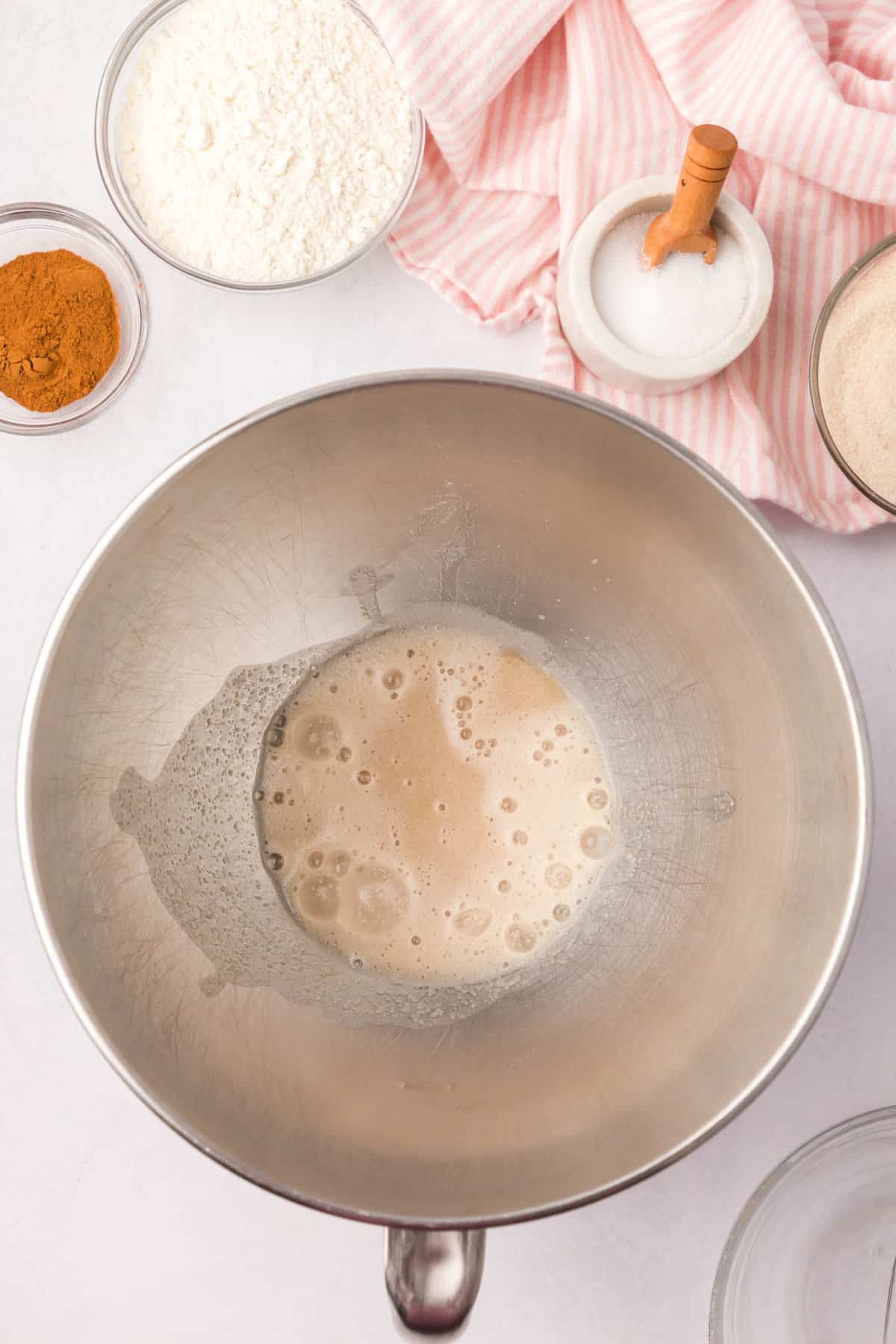 Adding warmed and active yeast in mixing bowl for Cinnamon Swirl Bread