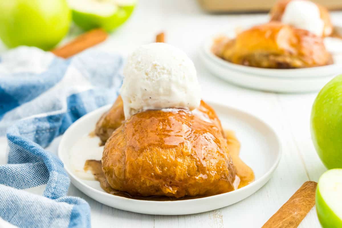 Crescent Roll Apple Dumplings topped with ice cream on plate