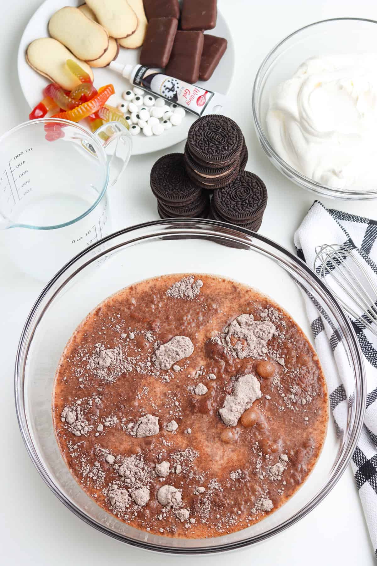 Mixing bowl with milk and chocolate pudding mix before stirring