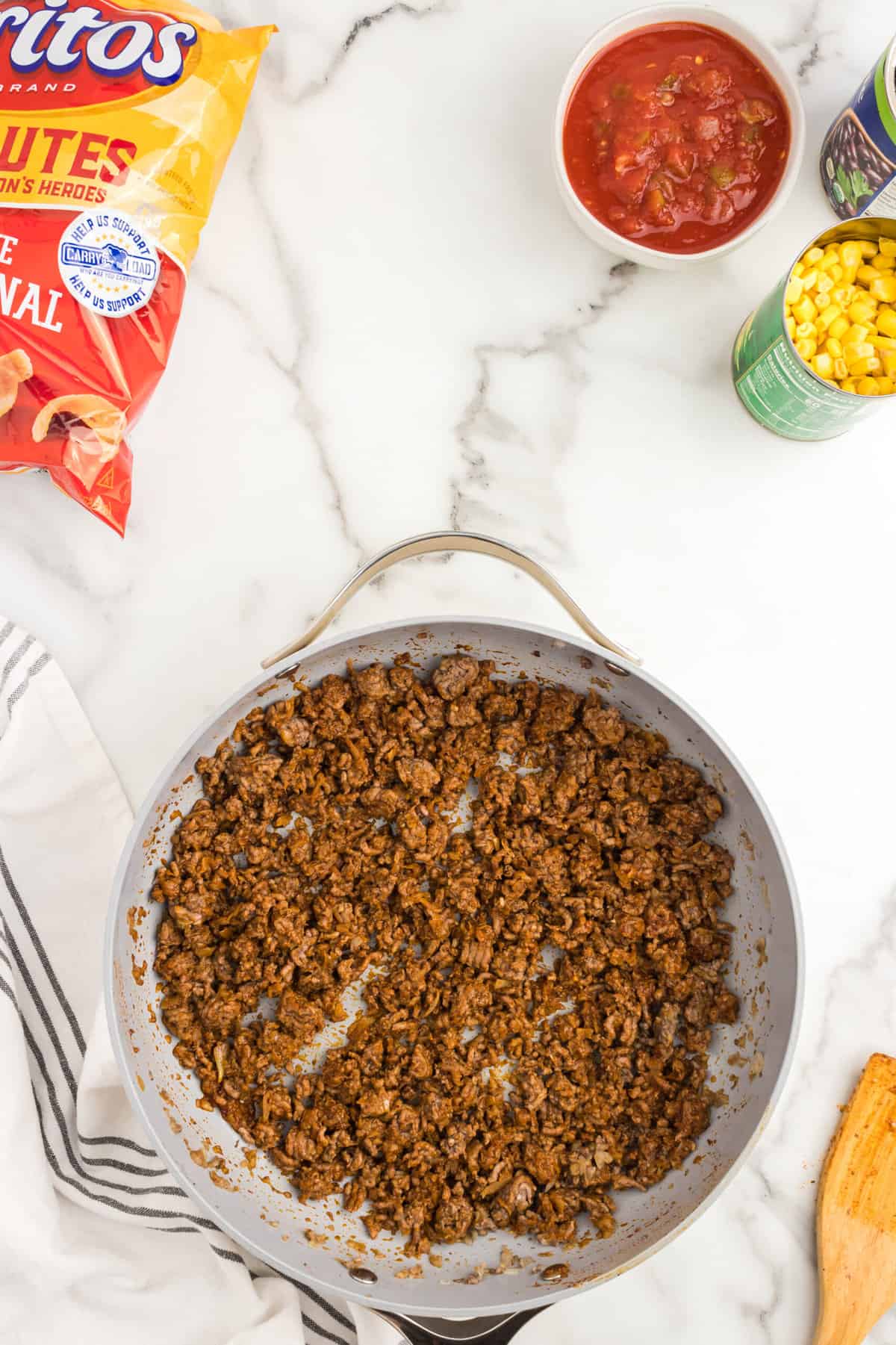 Seasoned ground beef in skillet for Frito Pie Casserole recipe