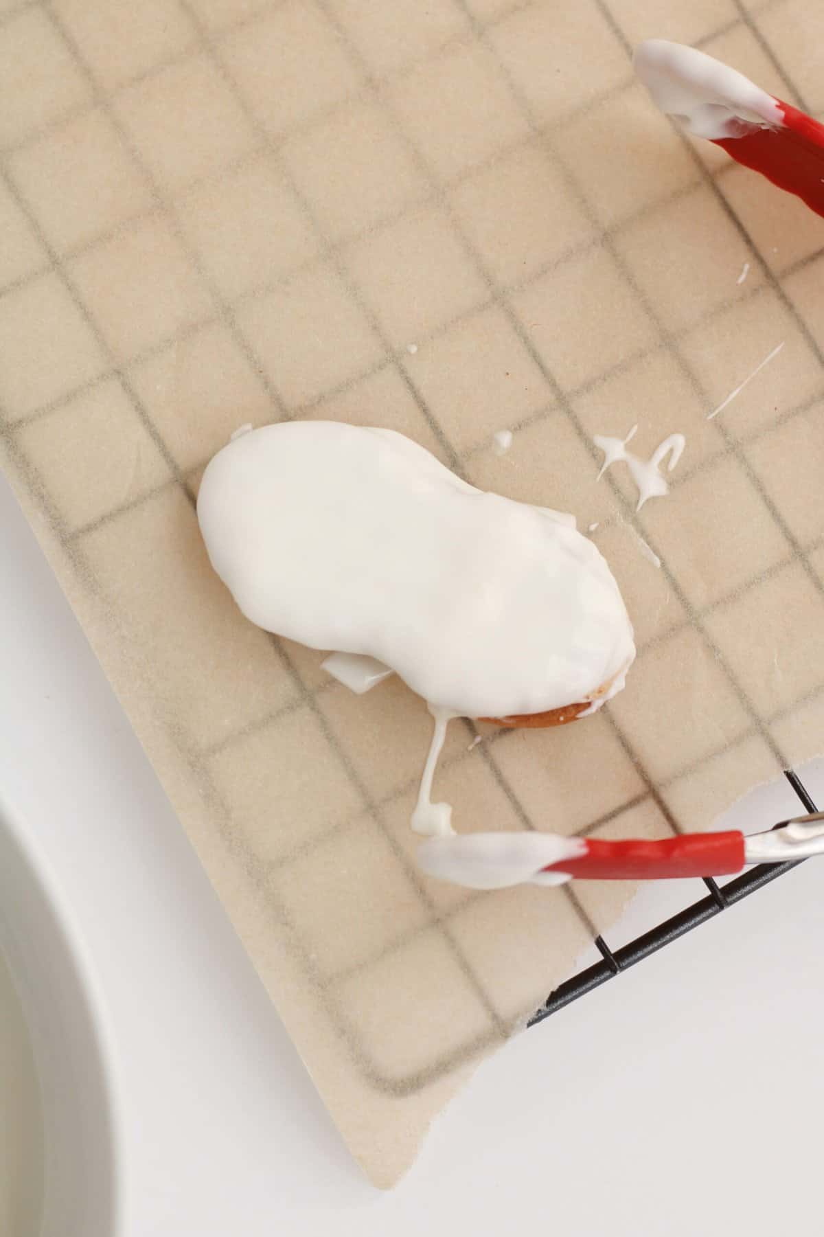 Place the Cookie on Parchment Paper with the cookie side down without any almond bark on it.