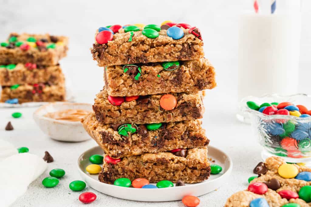 Monster Cookie Bars Cut and Stacked on Plate