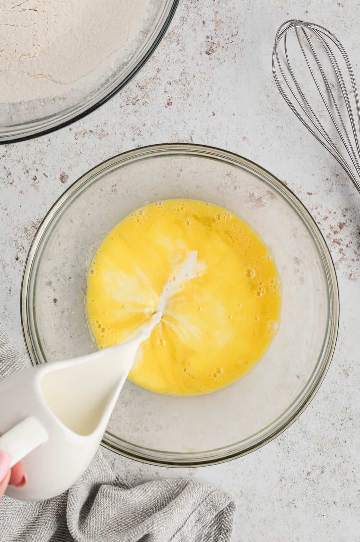 Mixing wet ingredients in mixing bowl for Pancake Recipe