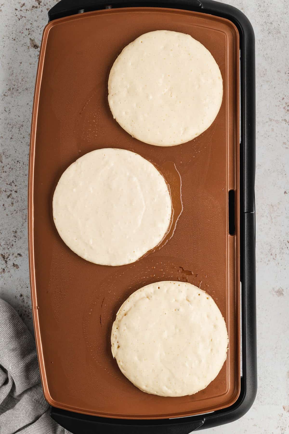 Batter on greased griddle for Homemade Pancakes