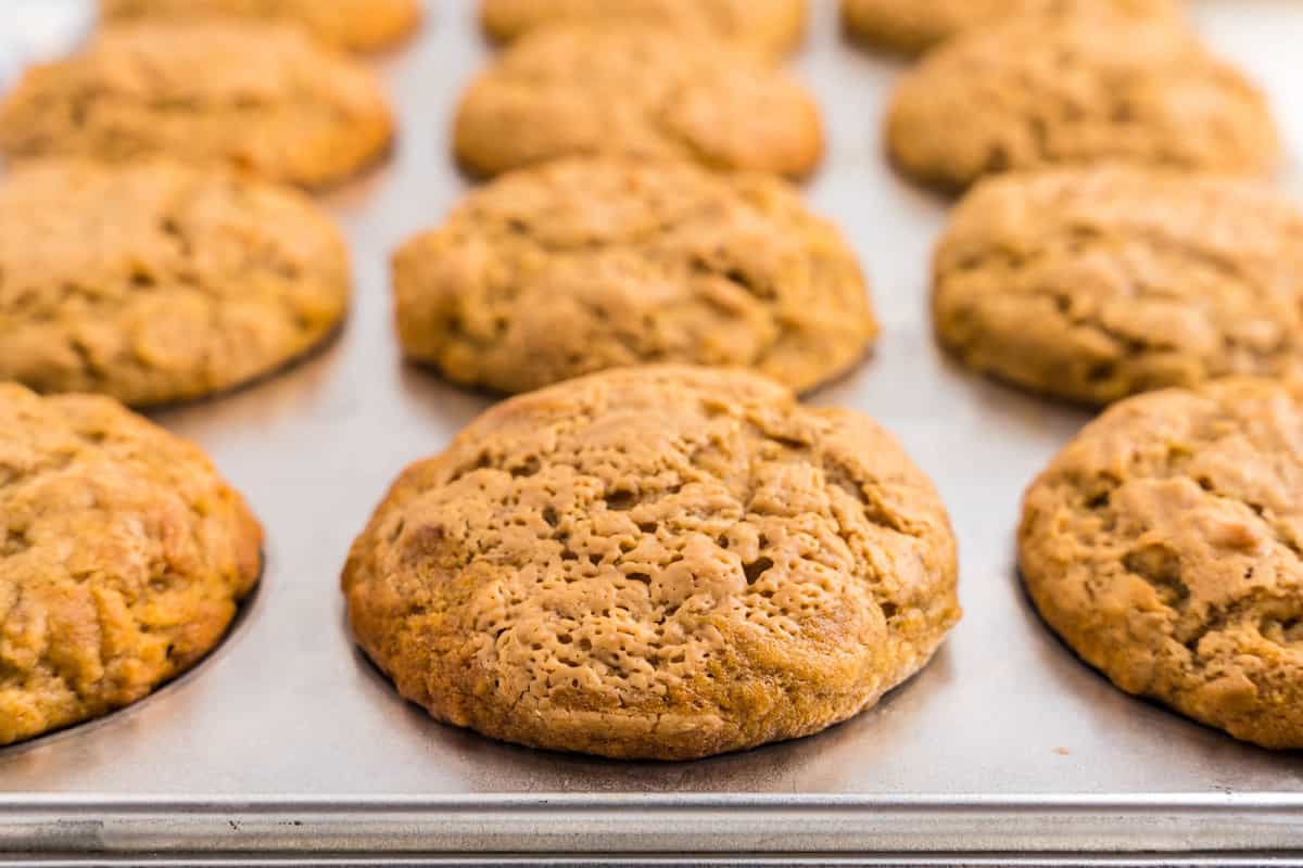 Close up of cooked banana muffins tops in a tin cupcake pan