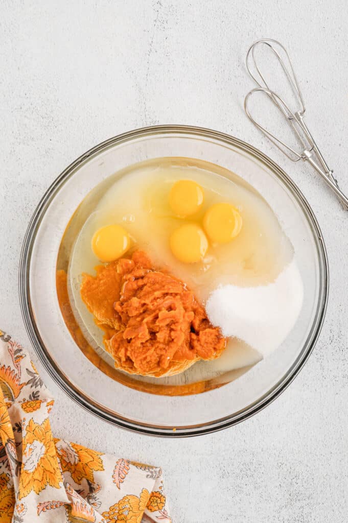Pumpkin Puree, Eggs, and Sugar in Mixing Bowl for Pumpkin Bars Recipe