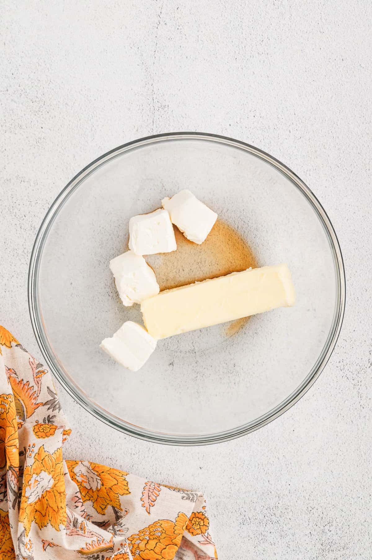 Cream cheese frosting ingredients in mixing bowl for Pumpkin Bars