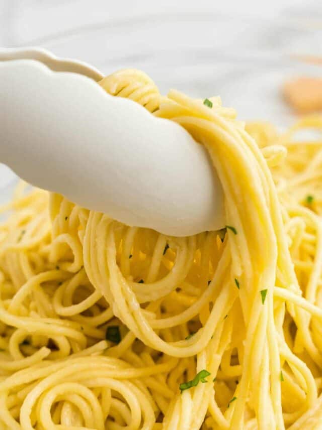 a Tongs serving buttered noodles.