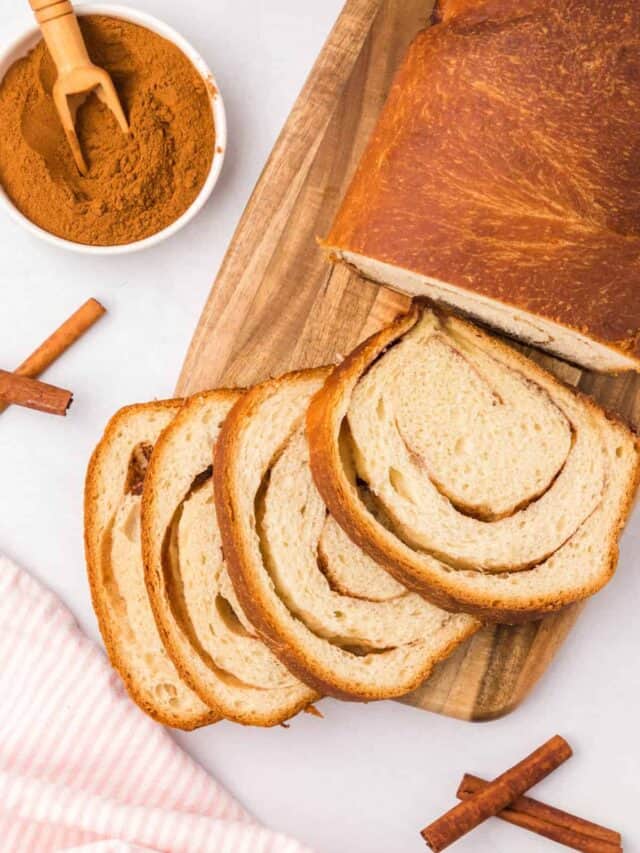 Cinnamon Swirl Bread Recipe sliced on wooden cutting board