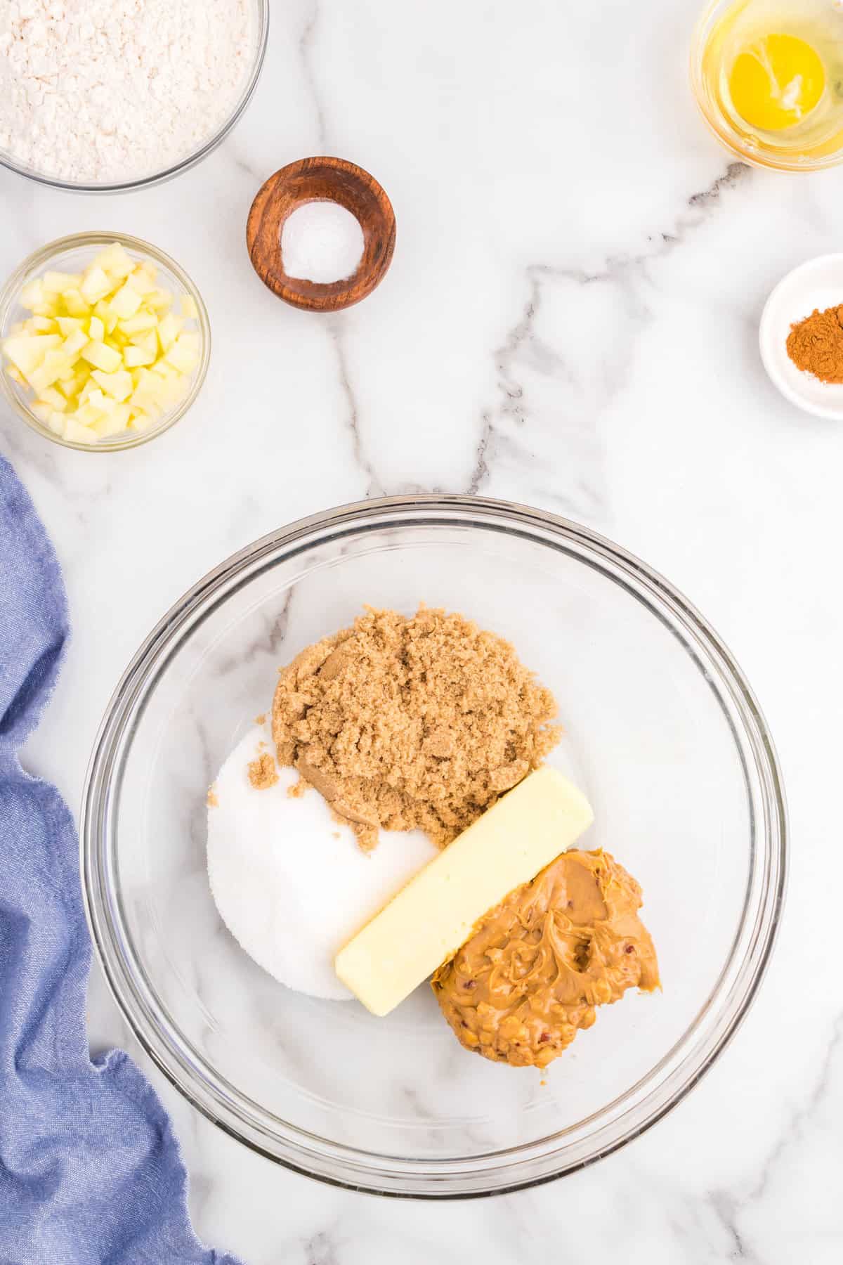 Cookie dough ingredients in mixing bowl for Apple Peanut Butter Cookies recipe