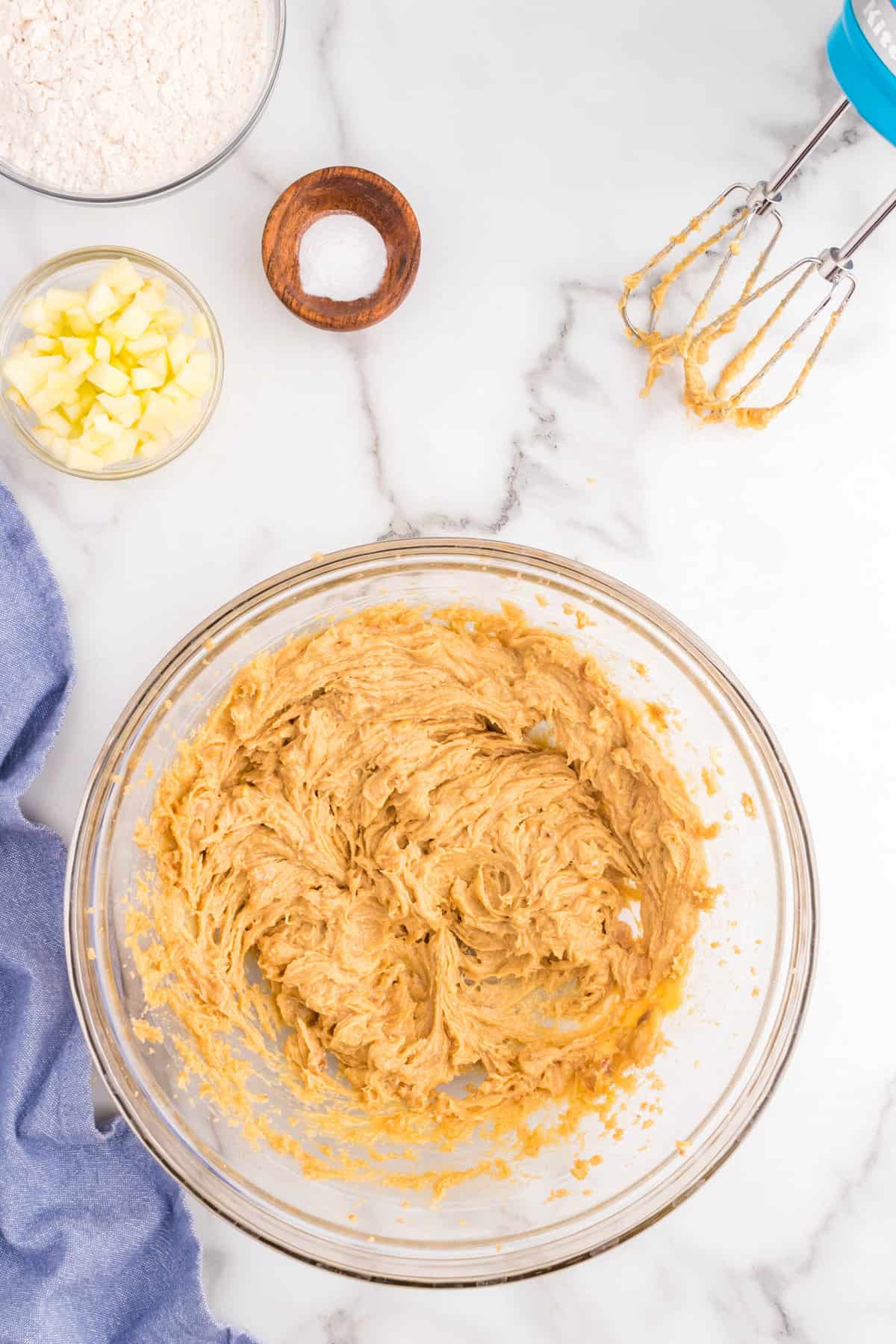 Mixed cookie dough ingredients for Apple Peanut Butter Cookies recipe