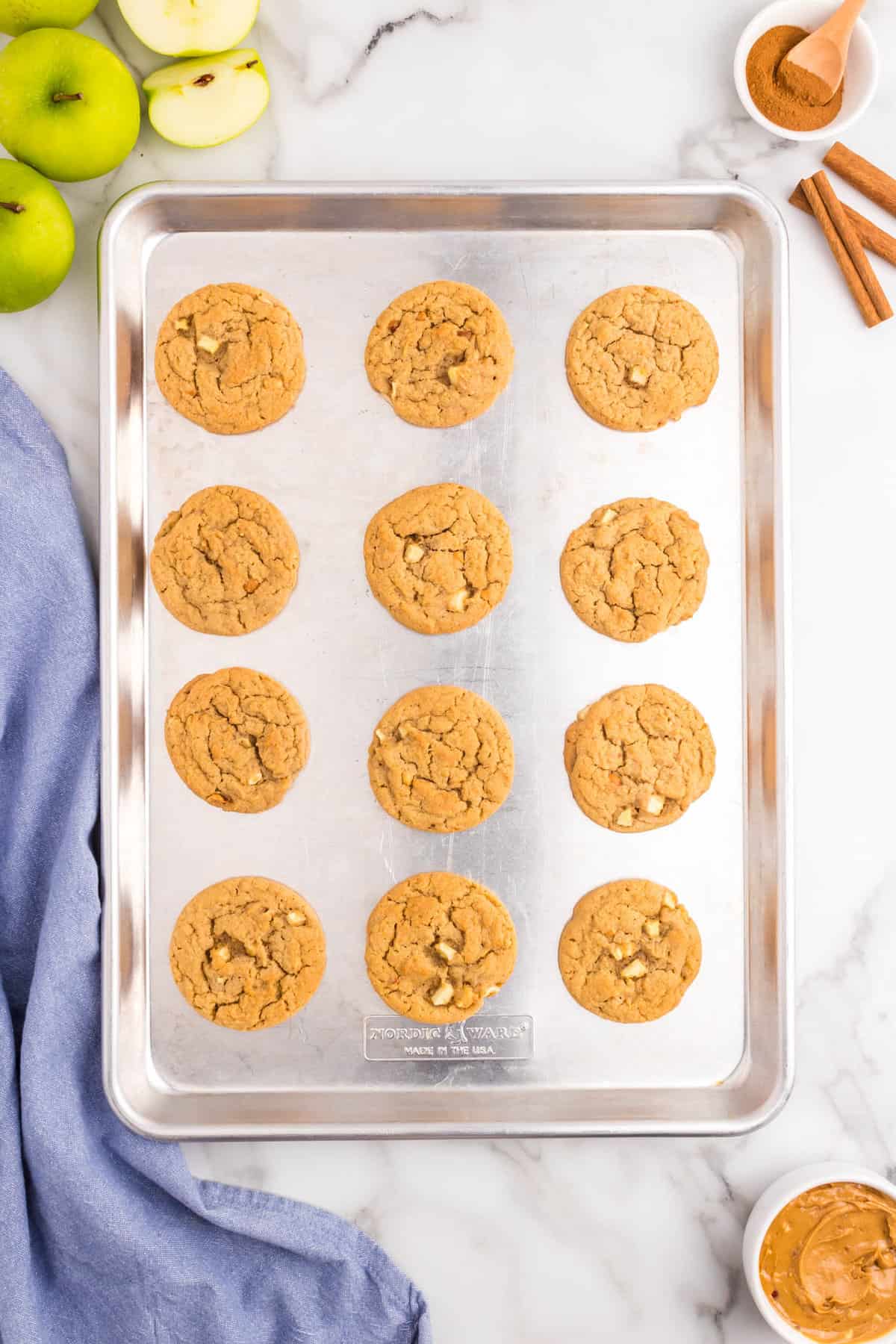 Apple Peanut Butter Cookies baked to a golden brown on a cookie sheet